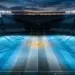Floodlit stadium pitch in Argentina blue and white with ball at centre spot, evening atmosphere.