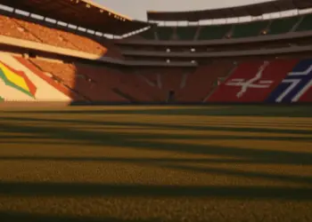 Floodlit stadium at golden hour showing packed stands with Côte d'Ivoire and Norway flag colours, empty pitch with dramatic shadows.
