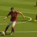 Manchester United midfielder controlling the ball in deep midfield position with teammate advancing into space