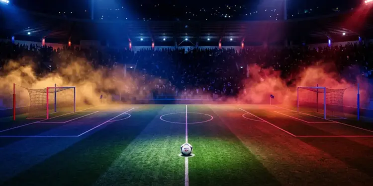 Floodlit stadium pitch with Haiti flag colours in dramatic lighting; football on centre spot; crowd silhouettes.
