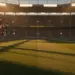 Floodlit stadium pitch at sunset with red-white and green-gold colour accents, dramatic shadows, and packed stands.