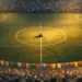 Aerial view of floodlit stadium pitch with coloured bunting in stands, ball on centre spot, golden-hour lighting.