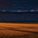 Floodlit stadium pitch at golden-hour with packed stands, dramatic shadows and cinematic lighting for World Cup quarter-final